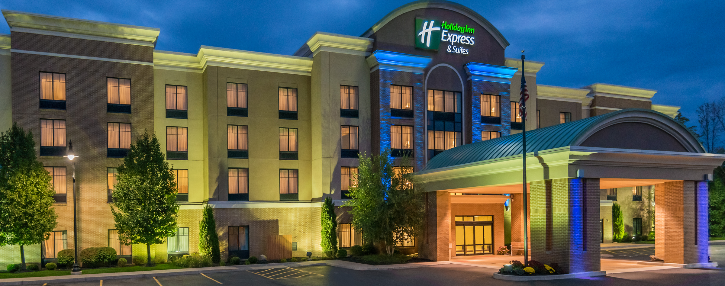 Holiday Inn Express & Suites Rochester Henrietta's exterior building at night