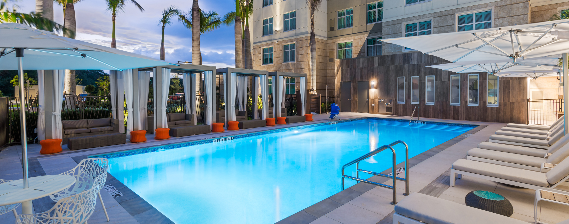 Outdoor pool at dusk at Homewood Suites Sarasota/Lakewood Ranch